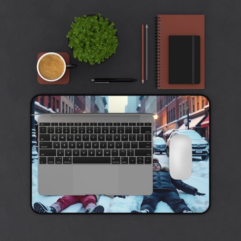 Winter Desk Mat with Snowy Cityscape and Whimsical Snow Angel Design - Image 3